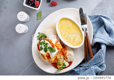 Breakfast egg burrito with grits Breakfast egg burrito with grits 104945776