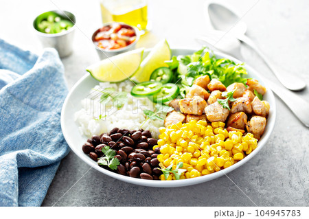 Chipotle spicy chicken with rice corn, beans 104945783