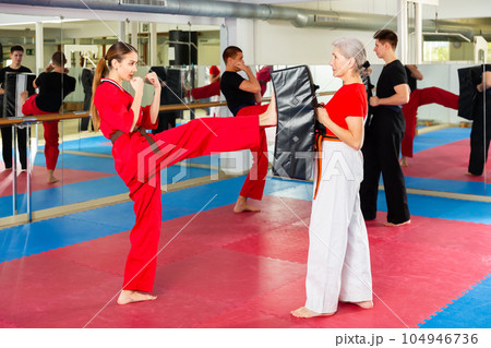 Two woman is training on self defense course in gym 104946736