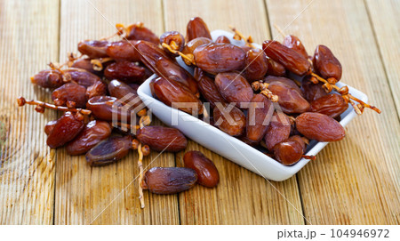 Close up of tropical dried fruits Kurma or dates, nobody 104946972