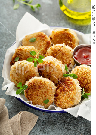 Chicken or fish patties with ketchup Chicken or fish patties with ketchup 104947590