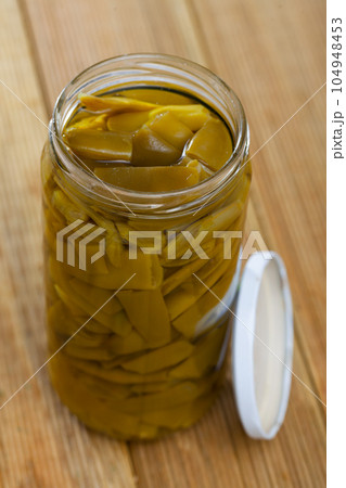 Glass jar of pickled flat beans Glass jar of pickled flat beans 104948453