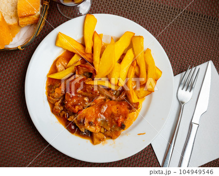 Dish of stewed rabbit and potatoes Dish of stewed rabbit and potatoes 104949546