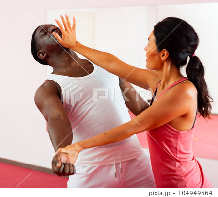 Woman doing strength techniques in self defense training 104949664