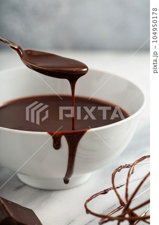Making chocolate glaze or sauce 104950178