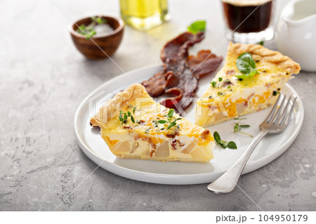 Breakfast plate with bacon and potato quiche Breakfast plate with bacon and potato quiche 104950179