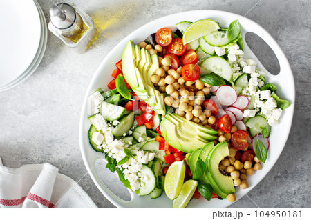Healthy vegetarian salad with chickpeas, avocado and feta Healthy vegetarian salad with chickpeas, avocado and feta 104950181