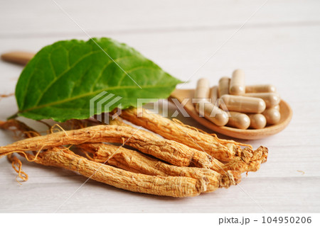 Ginseng roots and green leaf, healthy food. 104950206