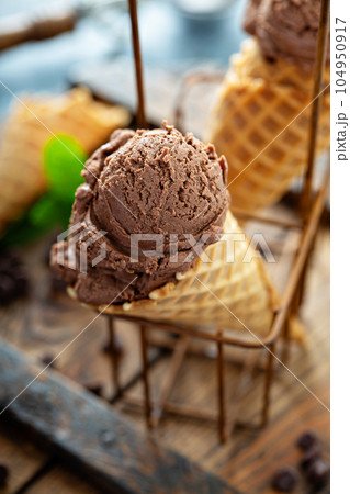 Chocolate mint ice cream in waffle cones Chocolate mint ice cream in waffle cones 104950917