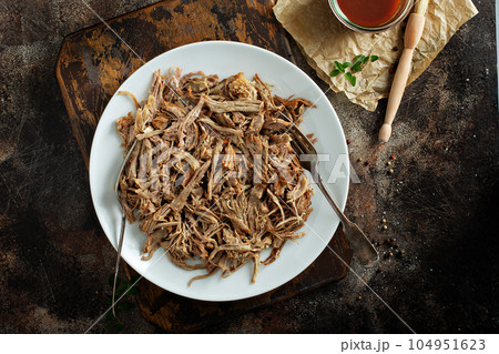 Pulled pork with forks on a plate Pulled pork with forks on a plate 104951623
