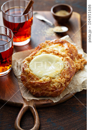 Cream cheese danishes with cinnamon tea 104951686