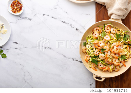 Shrimp and zucchini noodles pasta with parmesan Shrimp and zucchini noodles pasta with parmesan 104951712