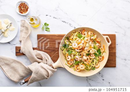 Shrimp and zucchini noodles pasta with parmesan Shrimp and zucchini noodles pasta with parmesan 104951715