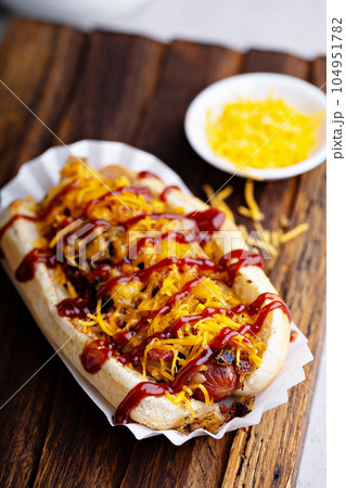 Grilled beef hot dog with bacon and cheese Grilled beef hot dog with bacon and cheese 104951782