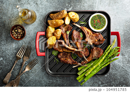 Grilled lamb chops with asparagus and potatoes Grilled lamb chops with asparagus and potatoes 104951785