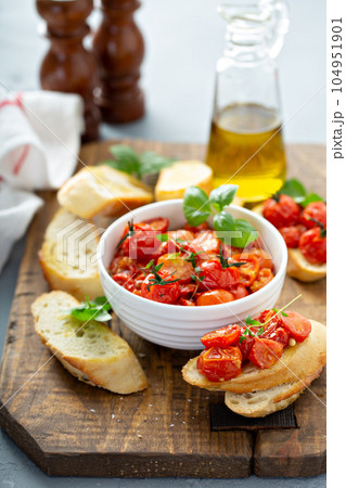 Bruschetta with roasted tomatoes Bruschetta with roasted tomatoes 104951901