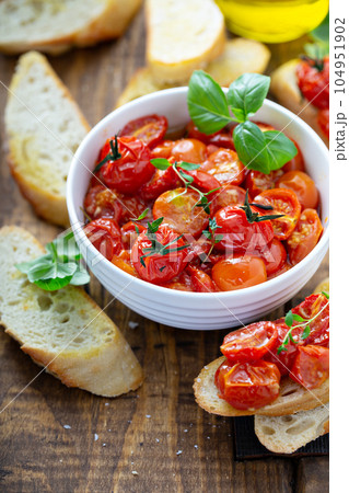 Bruschetta with roasted tomatoes Bruschetta with roasted tomatoes 104951902