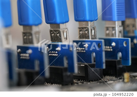 Detail photo of PCI graphics cards risers on cryptocurrency mining rig 104952220