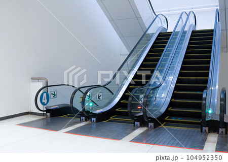 escalators stairway in modern building 104952350