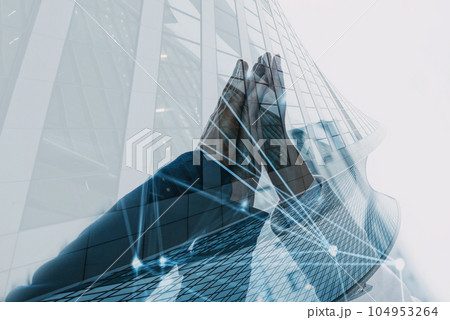 Handshaking between businessmen. Double exposure with modern office Handshaking between businessmen. Double exposure with modern office 104953264