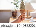 close up of woman hands holding ice cream cone 104953550