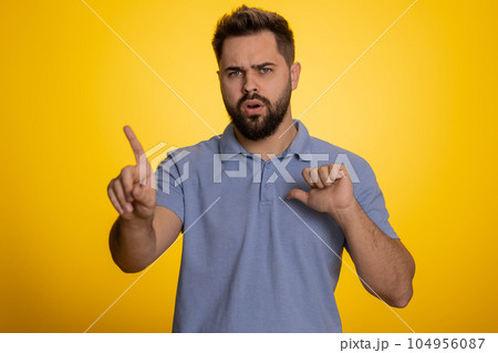 Confused displeased surprised caucasian man pointing fingers hisself, rejection, refusal, stop sign Confused displeased surprised caucasian man pointing fingers hisself, rejection, refusal, stop sign 104956087