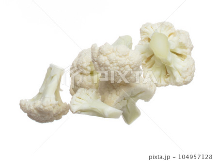 Cauliflower fly fall mid air, green fresh vegetable Cauliflower cut chop slice. Organic fresh vegetable Cauliflower, close up texture. White background isolated freeze motion high speed shutter 104957128