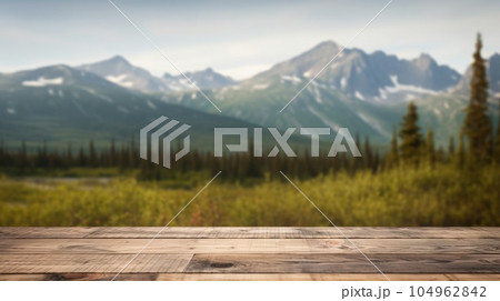 The empty wooden table top with blur background of Alaska nature. Exuberant. The empty wooden table top with blur background of Alaska nature. Exuberant. 104962842