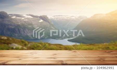 The empty wooden brown table top with blur background of Norway nature landscape. Exuberant. The empty wooden brown table top with blur background of Norway nature landscape. Exuberant. 104962991
