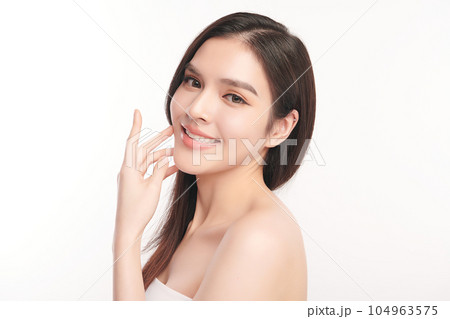 Beautiful young asian woman with clean fresh skin on white background, Face care, Facial treatment, Cosmetology, beauty and spa, Asian women portrait. Beautiful young asian woman with clean fresh skin on white background, Face care, Facial treatment, Cosmetology, beauty and spa, Asian women portrait. 104963575