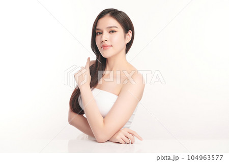 Beautiful young asian woman with clean fresh skin on white background, Face care, Facial treatment, Cosmetology, beauty and spa, Asian women portrait. Beautiful young asian woman with clean fresh skin on white background, Face care, Facial treatment, Cosmetology, beauty and spa, Asian women portrait. 104963577