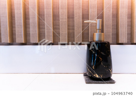 Soap dispensers on table in toilet Soap dispensers on table in toilet 104963740