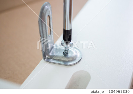 Assembly furniture using screwdriver at home Assembly furniture using screwdriver at home 104965830