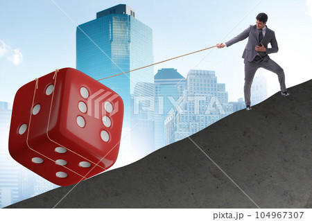 Uncertainty concept with businessman and dice Uncertainty concept with businessman and dice 104967307