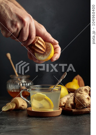 Ginger tea with lemon and honey. 104968400