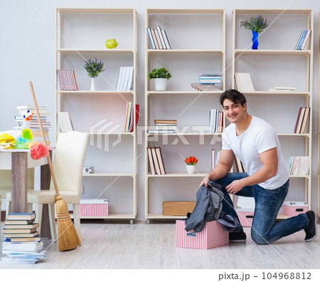 Man doing cleaning at home Man doing cleaning at home 104968812