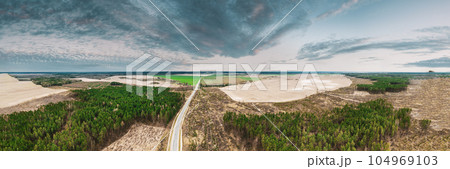 Aerial View Of Highway Road Through Deforestation Area Landscape. Green Pine Forest In Deforestation Zone. Top View Of Field And Forest Landscape. Drone View. Bird's Eye View. 104969103