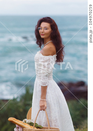 Stylish Summer Beach Outfit for Boho Picnic by the Sea of Romantic Woman Stylish Summer Beach Outfit for Boho Picnic by the Sea of Romantic Woman 104970259