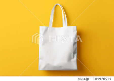Blank white fabric bag mockup, yellow background Blank white fabric bag mockup, yellow background 104970514