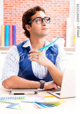 Young designer freelancer working on new project 104971559