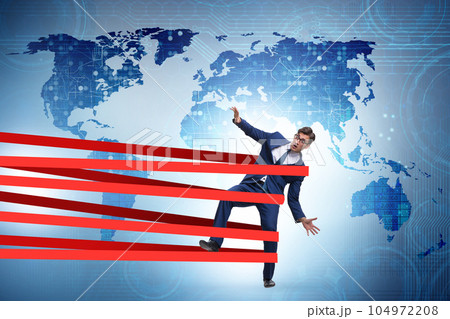 Businessman being harnessed and restricted Businessman being harnessed and restricted 104972208