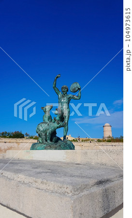 Close view of the ancient sculpture Le Dresseur d'oursons in Marseille in South France 104973615