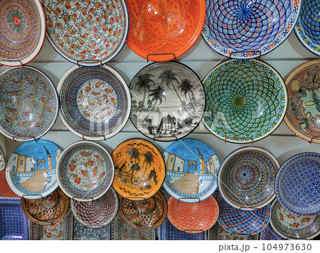 Traditional clay plates on the market of Tunisia. Traditional clay plates on the market of Tunisia. 104973630