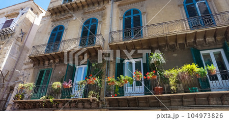 Old facade of historical building in Palermo, Italy 104973826