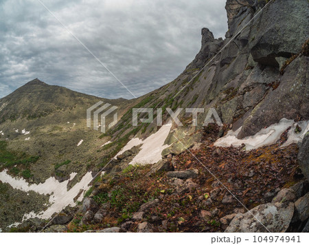 Mountain difficult track through Western Sayans kurumnik, stones, cobblestones, moss with a unique landscape. Landscape photography of stone river (called also stone run, stone stream or stone sea. 104974941