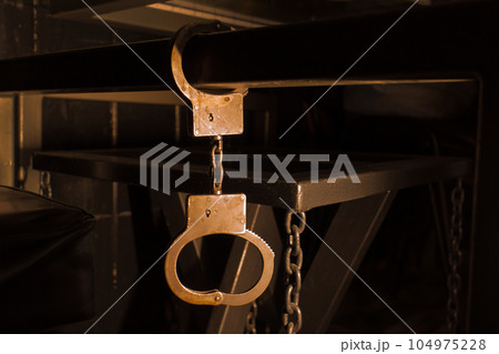 Crime justice arrest criminal object chain law legal control metal rusty police lock handcuff concept 104975228