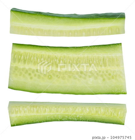 Green cucumber slices on a white isolated background. The cucumber is cut into strips of different sizes, depicted from different sides on a white background. High quality photo. 104975745