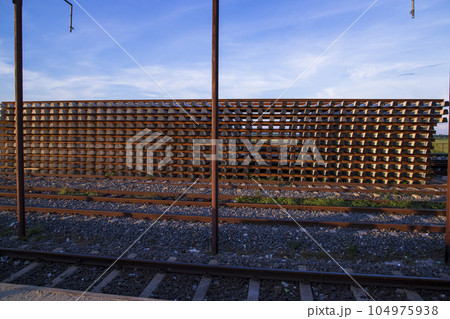 Railway Concrete sleepers stacked under the blue sky for the construction of a new track in Bangladesh 104975938