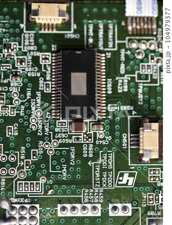 Blue board with radio elements. A chip with a processor and transistors. Diodes and resistors. Microchip. Blue board with radio elements. A chip with a processor and transistors. Diodes and resistors. Microchip. 104979377
