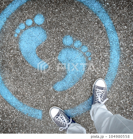 Man standing on blue dot Man standing on blue dot 104980558